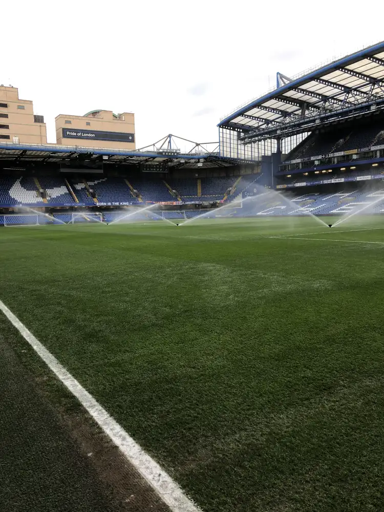Stamford Bridge Chelsea FC pre-match pop-up sprinkler irrigation across the pitch